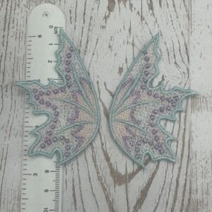 Flügel Hellblau / rosa 7,5 x 5 cm